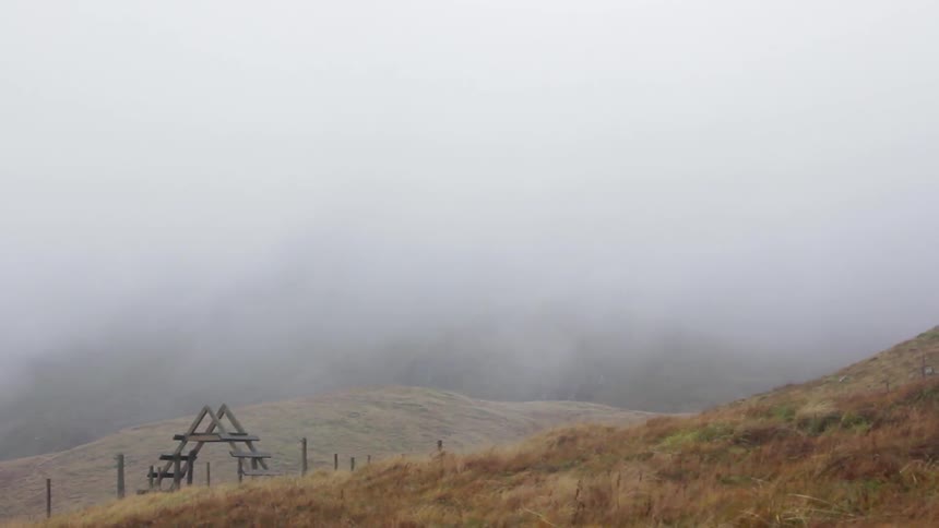 Fog rolls over a countryside