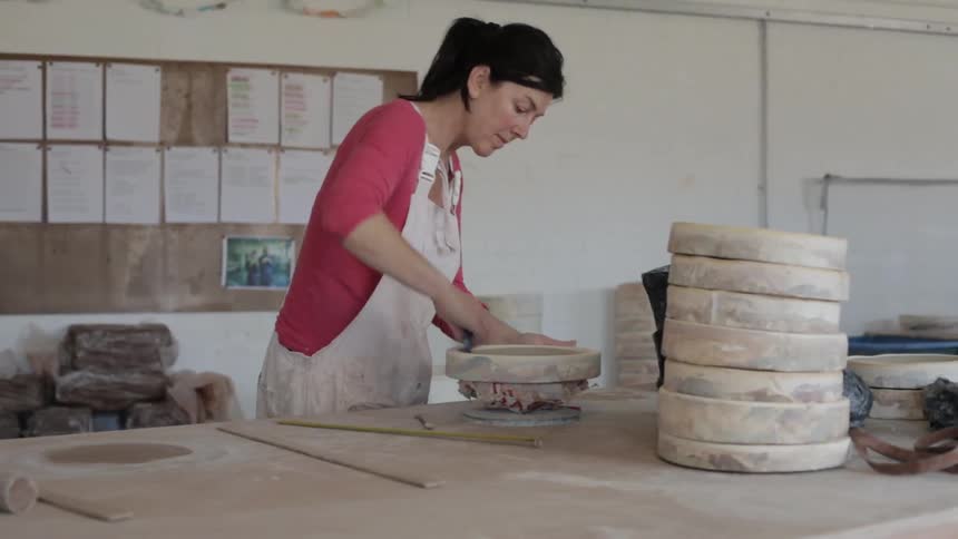 A person making pottery