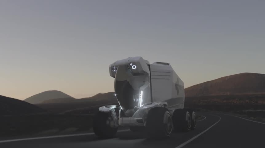 A robot tank drives through the desert
