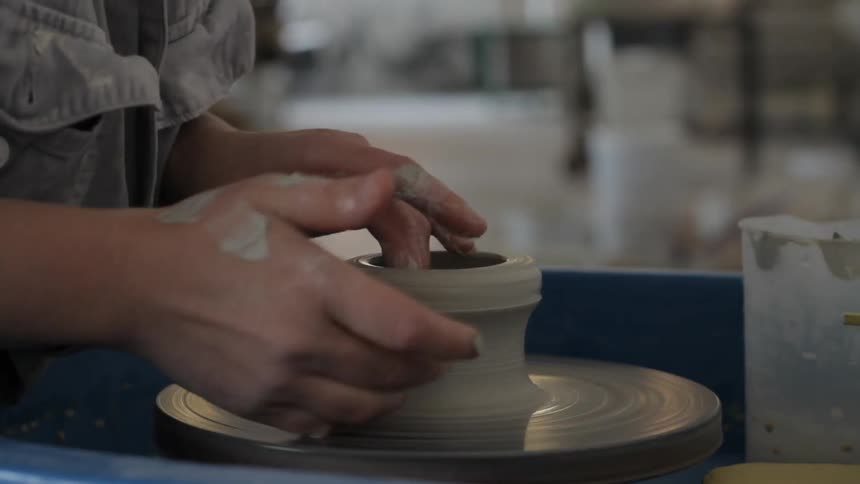 A woman is making a bowl