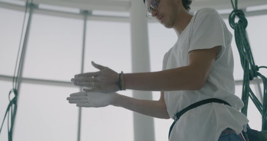 A person rubs powder on their hands