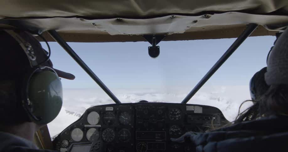 Pilots fly a small aircraft