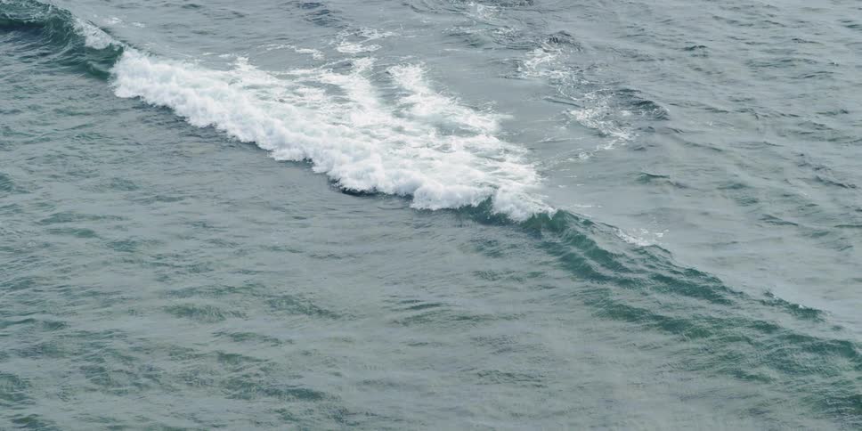 Waves flow across the ocean surface
