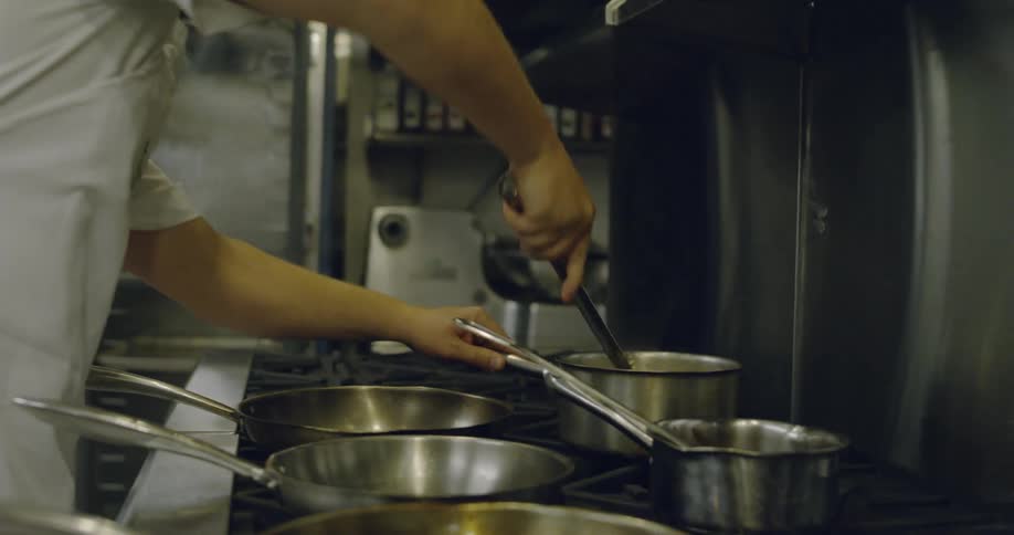 A chef cooks in a restaurant