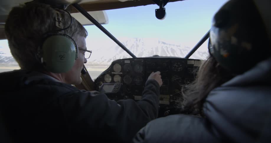 A pilot is preparing to take off during the day