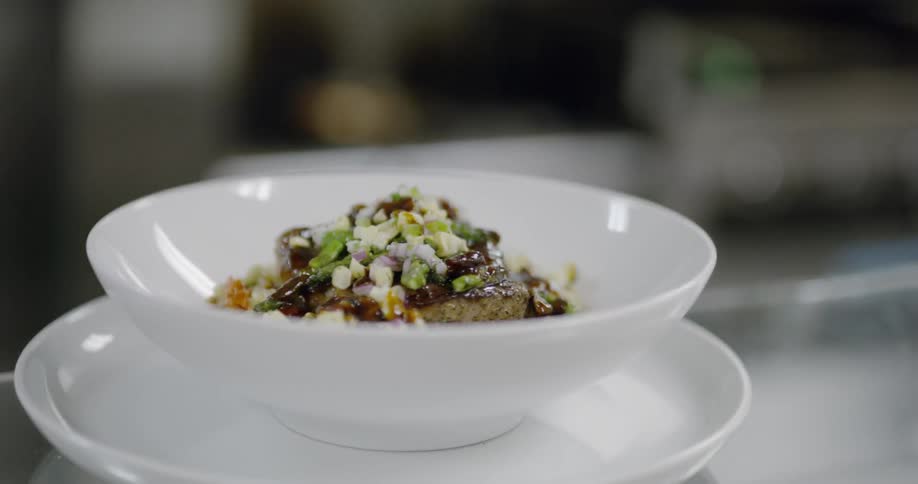 A bowl of food is placed on a table