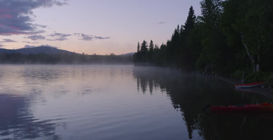 A mountain lake ripples and flows at dawn