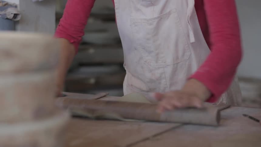 A person using a rolling pin