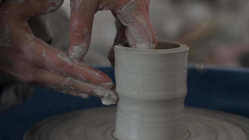 A person making pottery