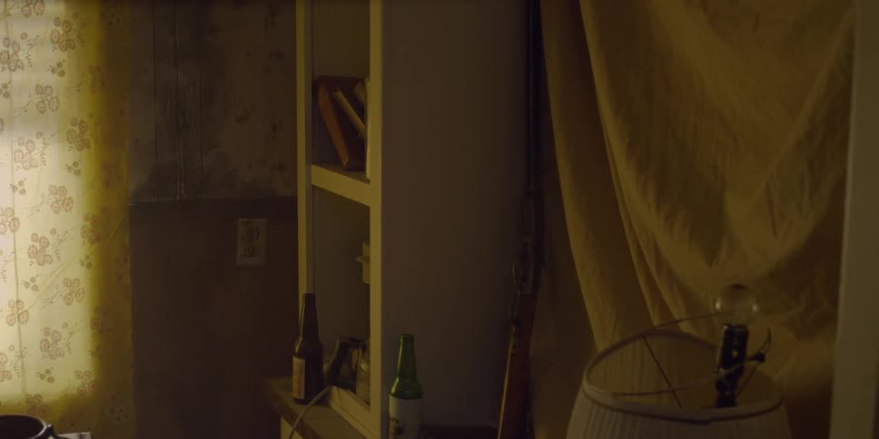 Man grabs rifle sitting on shelf