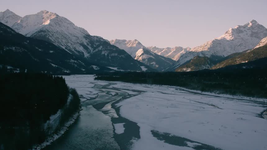 A river through a snowy valley