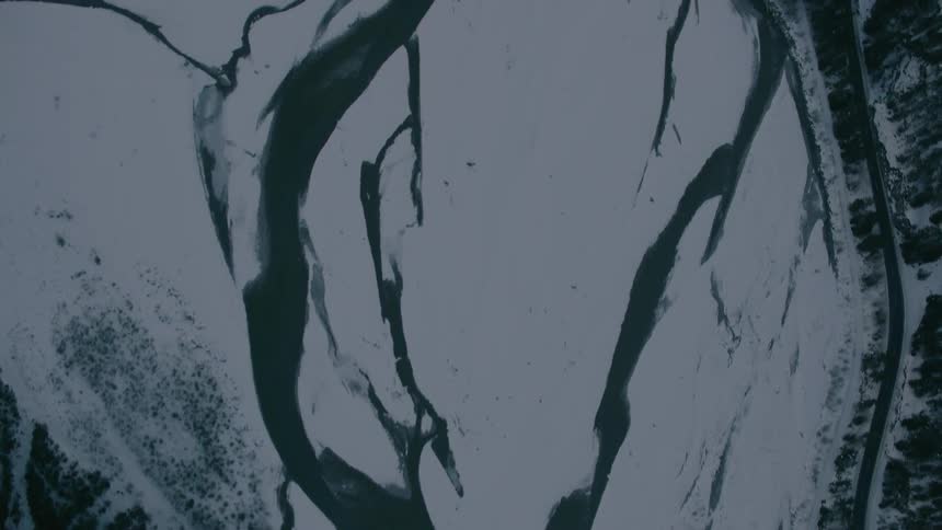 River flows through snowy ground