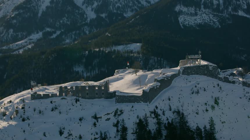 Snow covers the ground atop a mountain