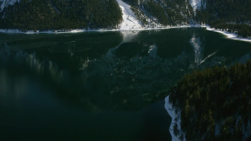 A lake at the base of a mountain