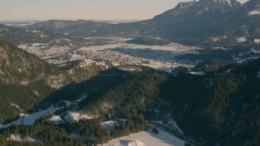 Snow covers a mountain landscape