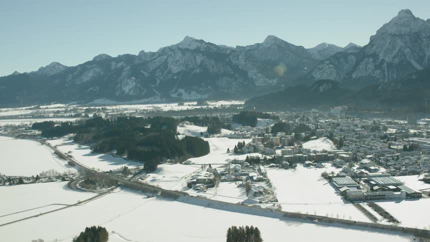 A snow covered village is viewed from the air