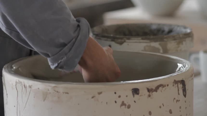 A person making pottery