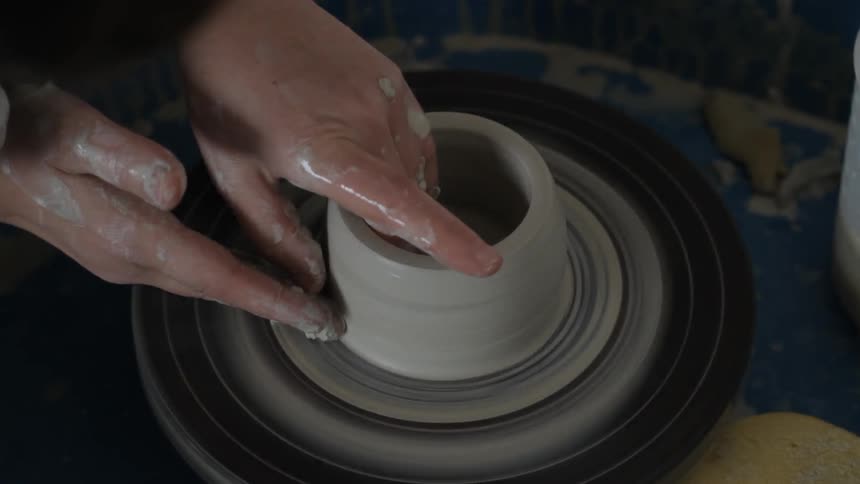 A person making pottery