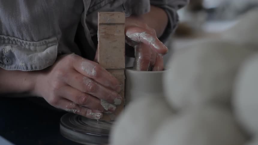 A person making pottery