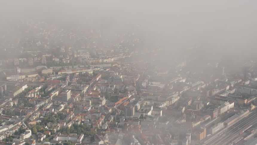 Clouds float over a large city
