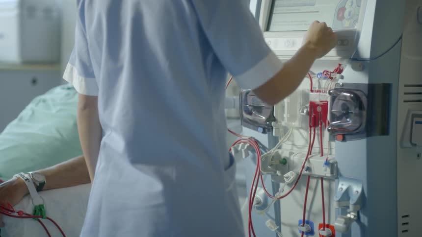 A person sets up a medical machine
