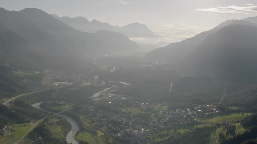 A valley with a river is surrounded by a mountains