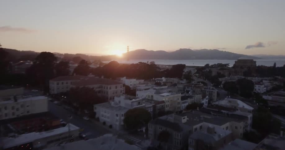 The sun sets on a coastal town