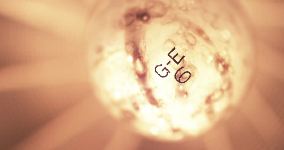 A light bulb lights on and off in slow motion