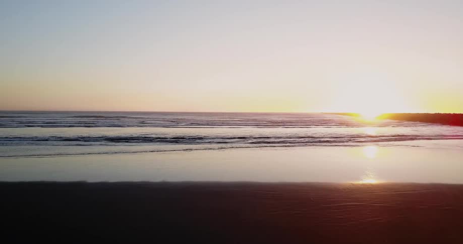 The sun is setting over the ocean