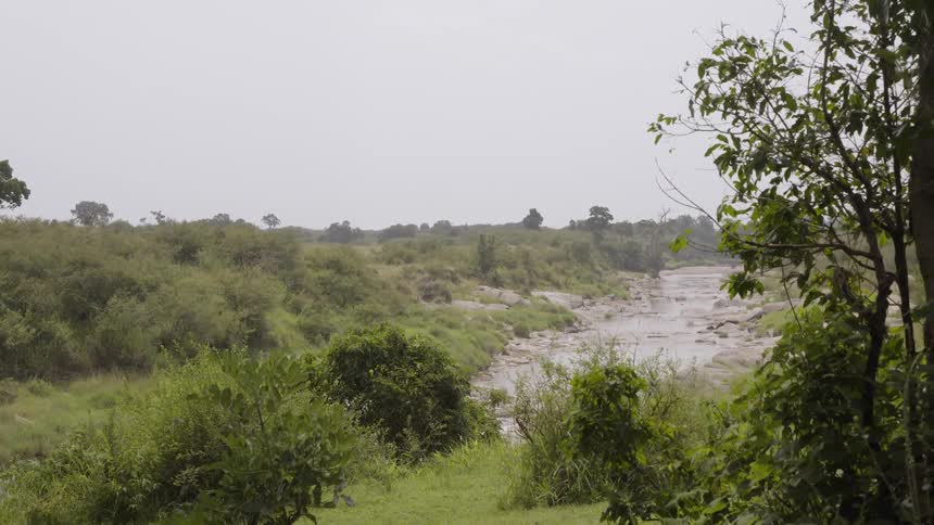 A small river is in the valley below the hill