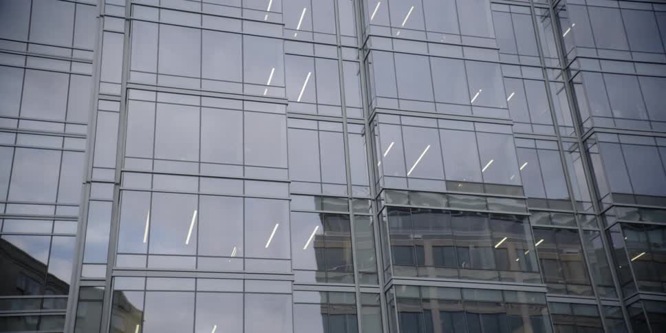Fluorescent lights seen through office windows