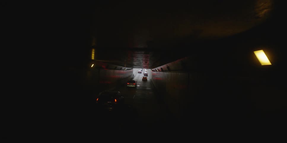 Cars pass through a tunnel