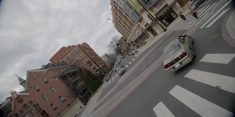 Cars make turns in the intersection in town
