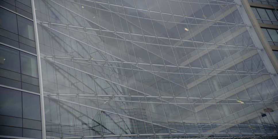 Glass windows cover a city building