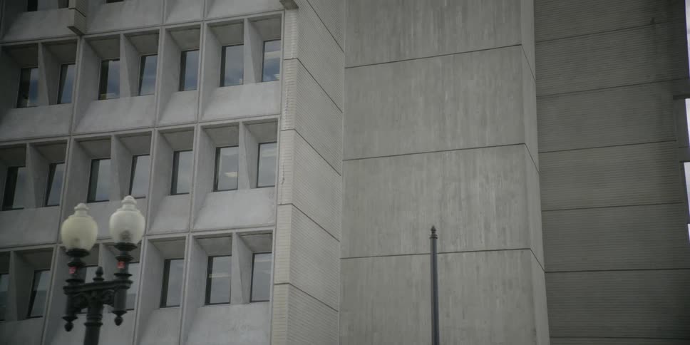 A concrete building stands in a city