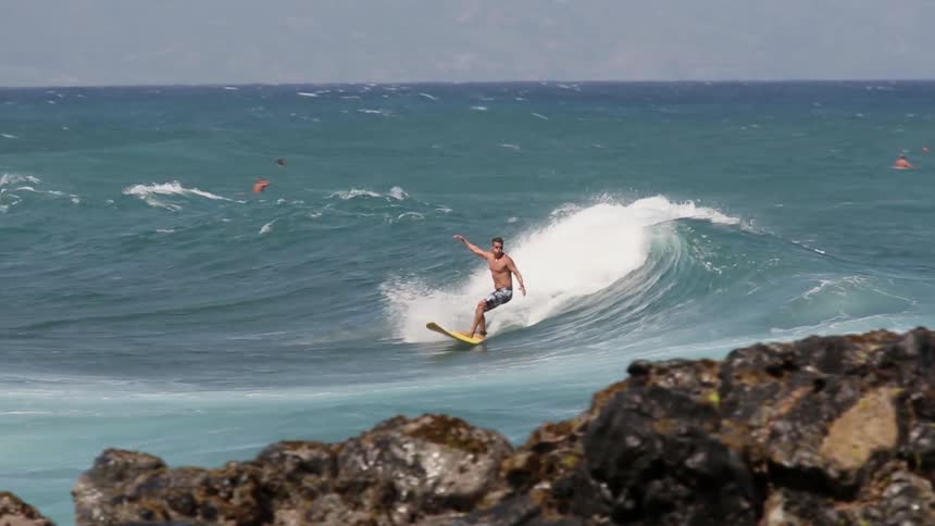 A man crashes out on a big wave