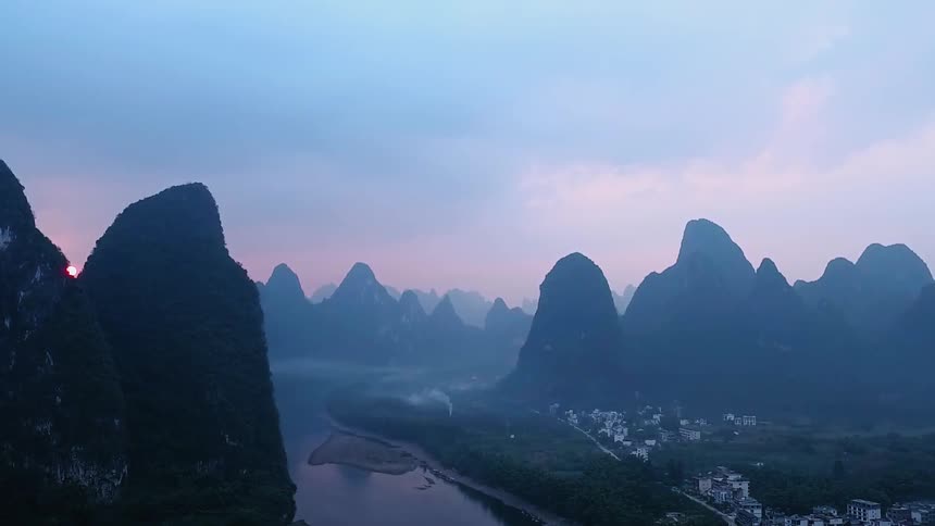 Mountains are shown at dusk