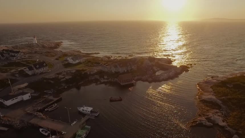 The sun shines on ocean water along the shore