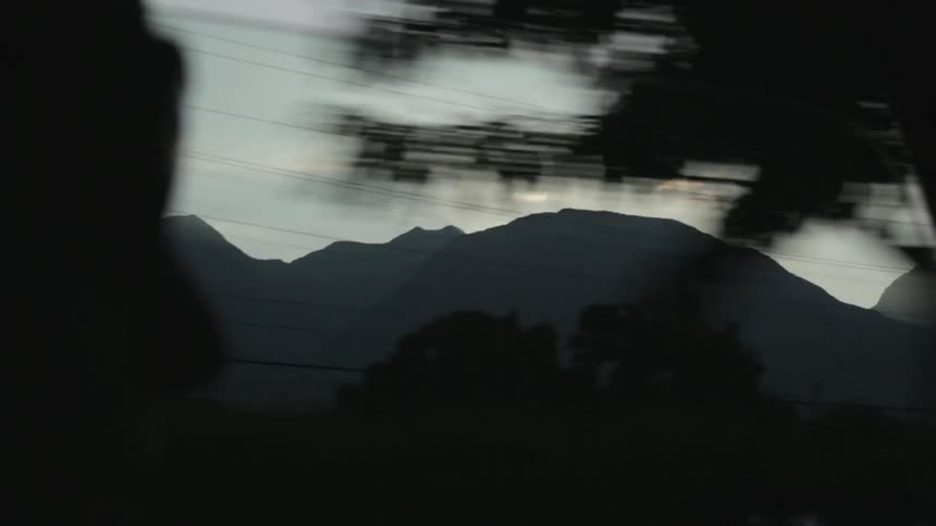 A mountain outside of a window
