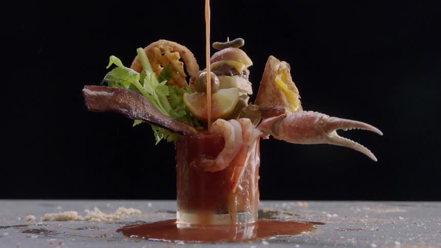 A drink is poured until it overflows
