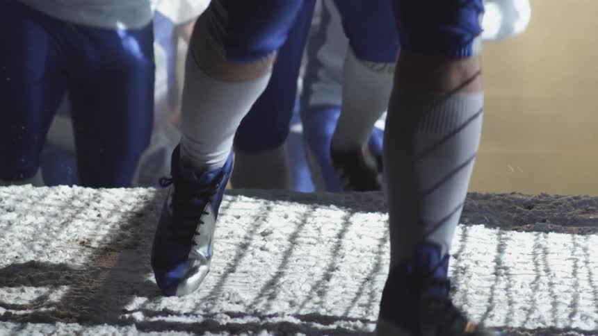 Players running up some steps together