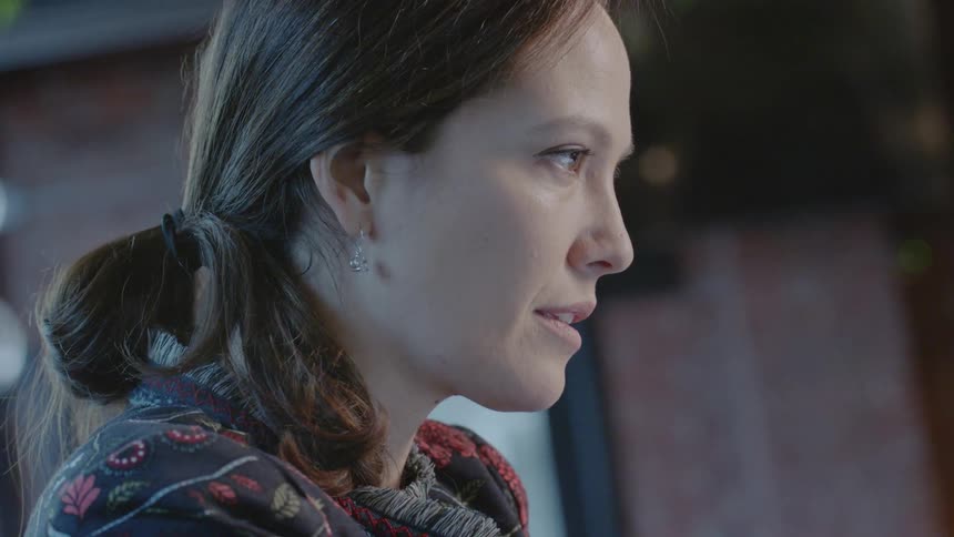 Woman reading with a pensive expression