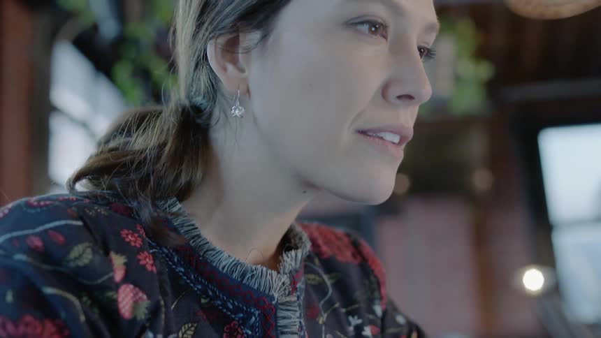 A woman works on a laptop