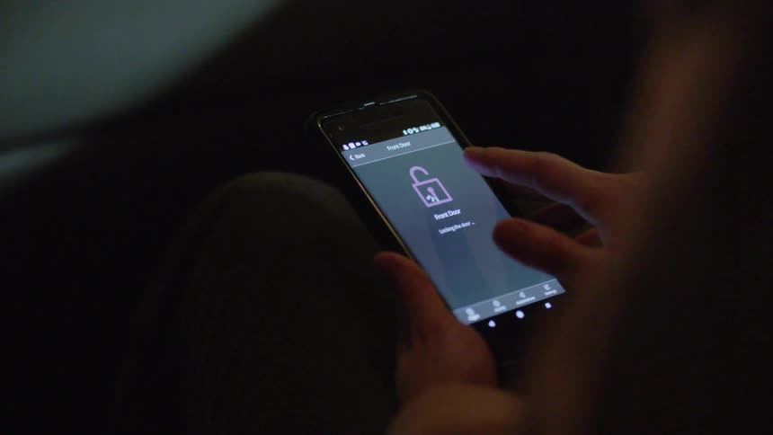 Person plays with the lock setting on their smartphone