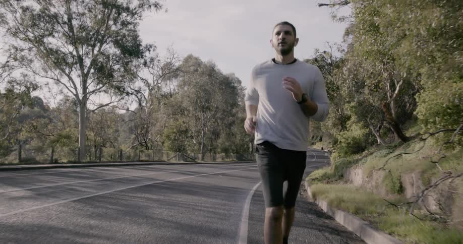 A person jogs down the road