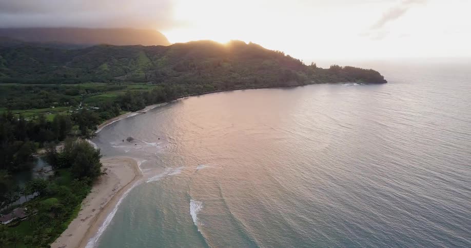 The sun sets over a beach