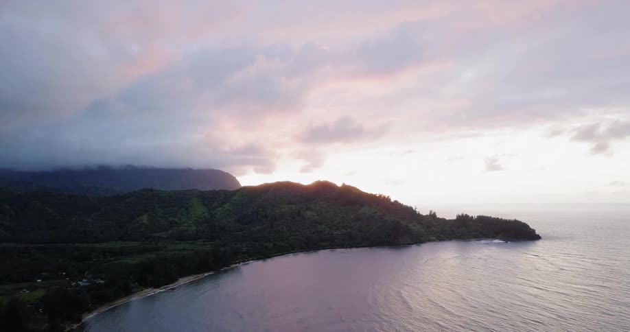 The water is calm along this shore on a cloudy day