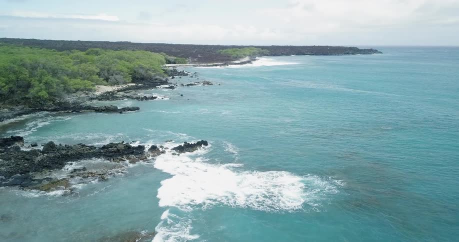 Waves are crashing along a shoreline