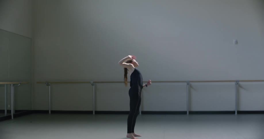 A woman dances in a studio