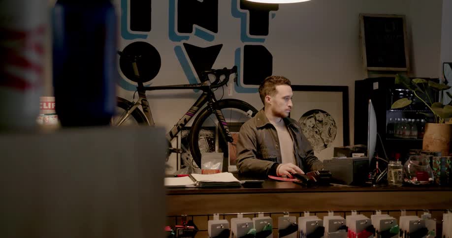 A man is sitting at a computer and working